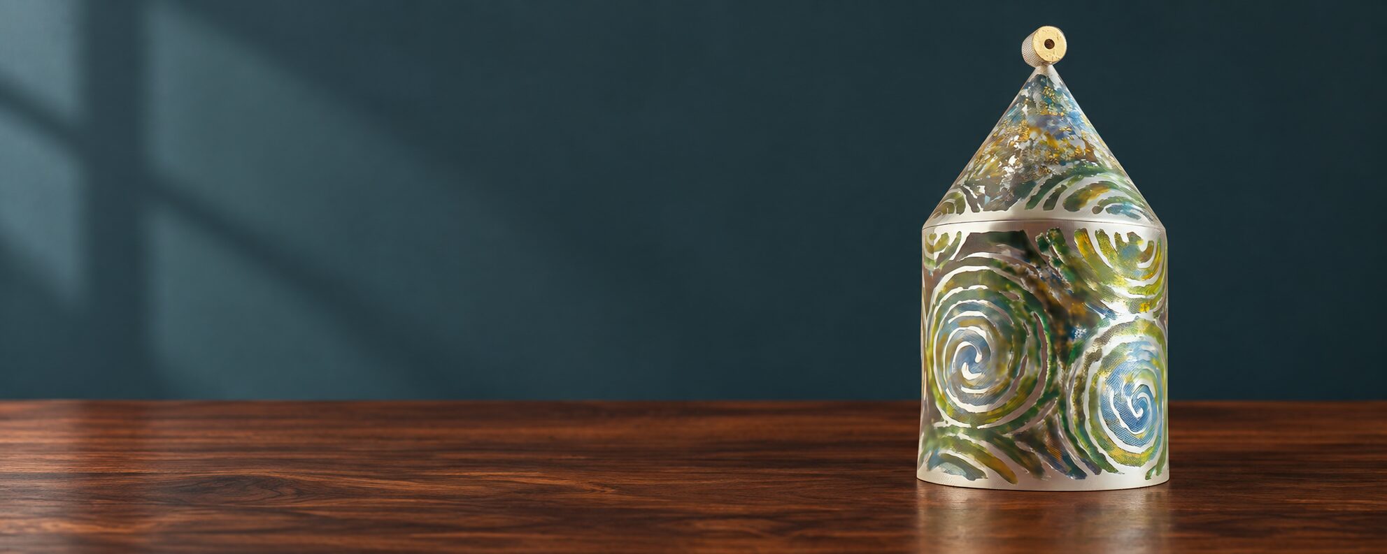 Memory Box by Joan Mackarell, displayed on a walnut table